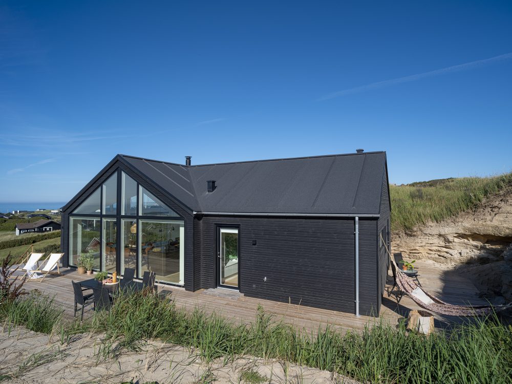 Sommerhus beliggende i område med klitter